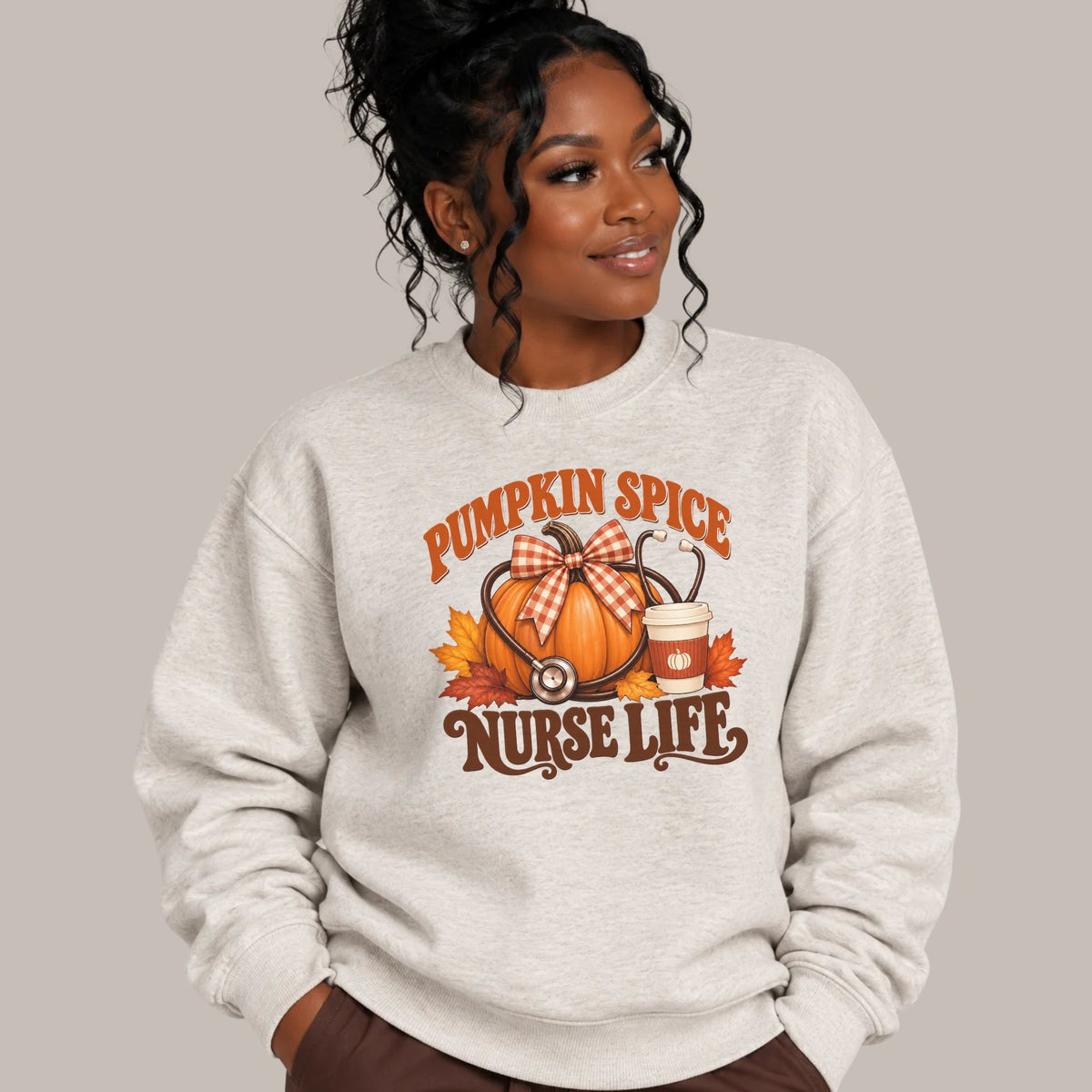 Oatmeal heather nurse crewneck with Pumpkin Spice Nurse Life autumn graphic modeled on person